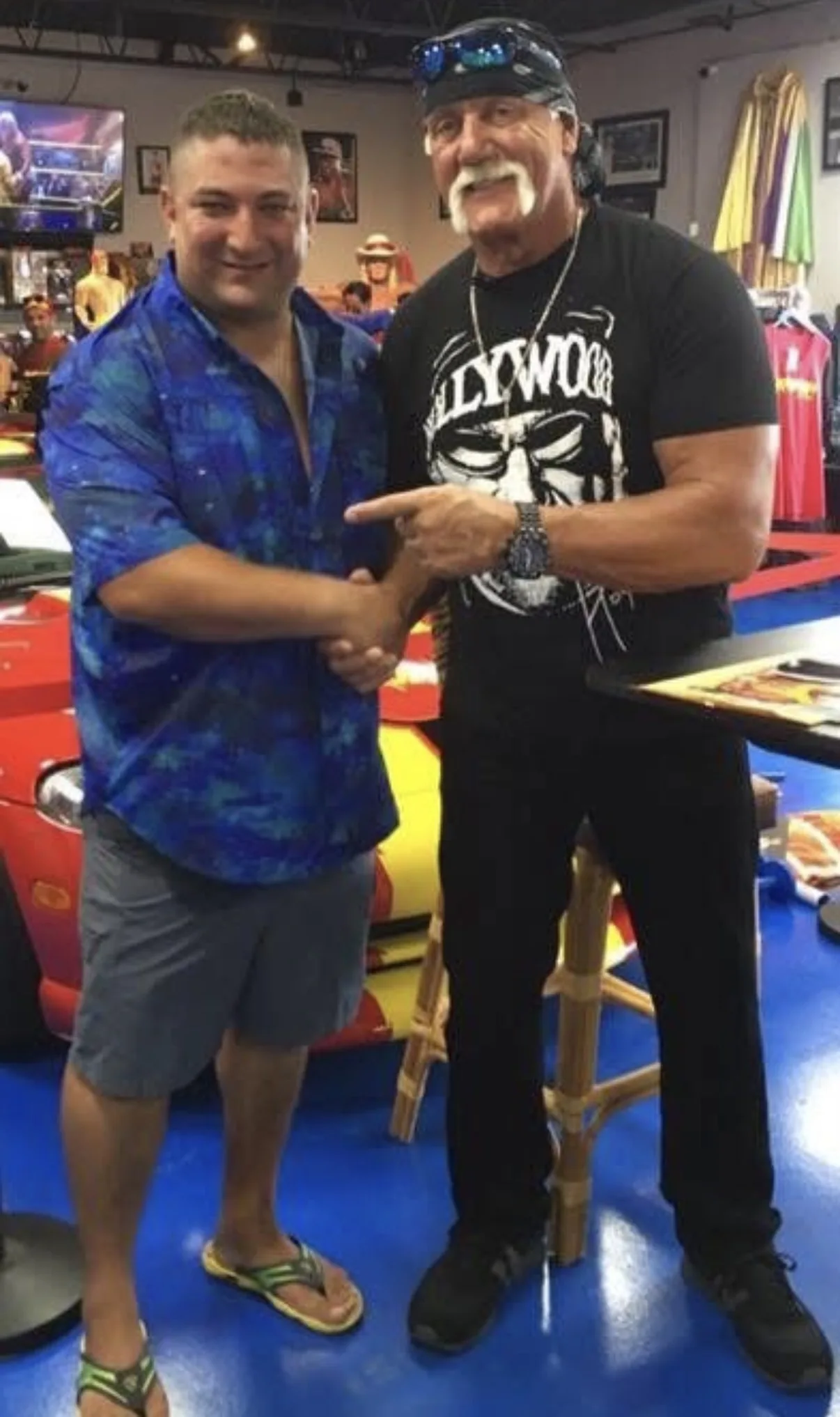 James Wojnar meeting a professional wrestling personality at a public event.